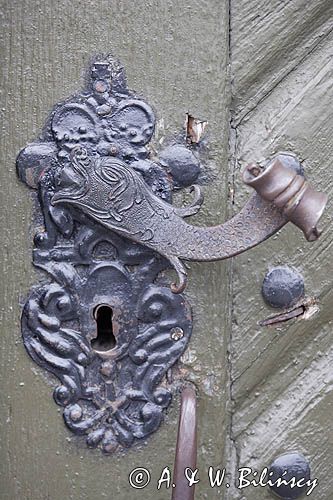 ozdobna klamka w kształcie ryby, drzwi Kościoła w Rydzynie
