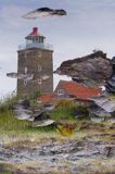 latarnia morska w Svaneke na wyspie Bornholm, odbicie w wodzie, Dania